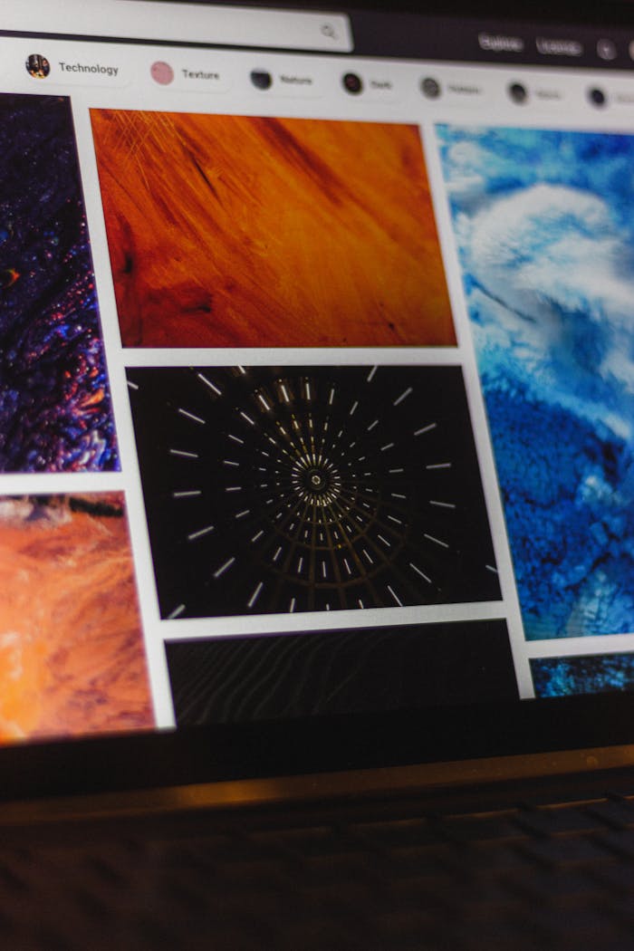 about-01 Portable computer with website representing assorted abstract photos under favorites and browser search engine with magnifier symbol